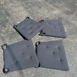 Set of four black seat cushions